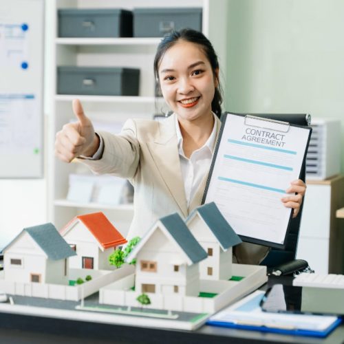 young-real-estate-agent-worker-working-with-laptop-2025-01-16-03-27-58-utc-w1080-h1920 A happy real estate agent