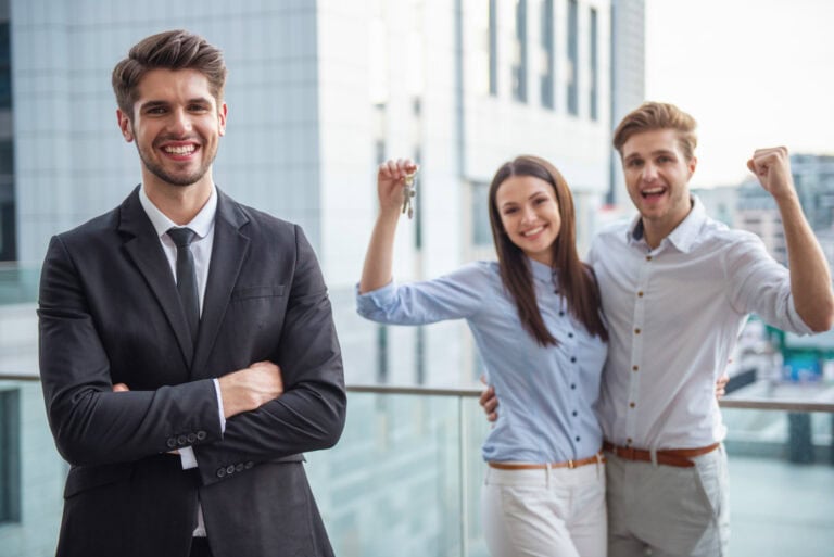 A happy new real estate agent with clients