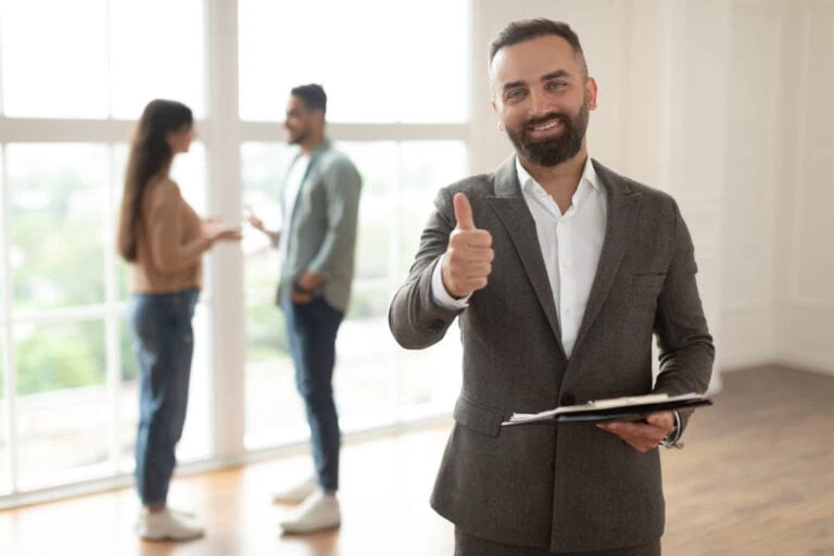A happy new real estate agent with clients