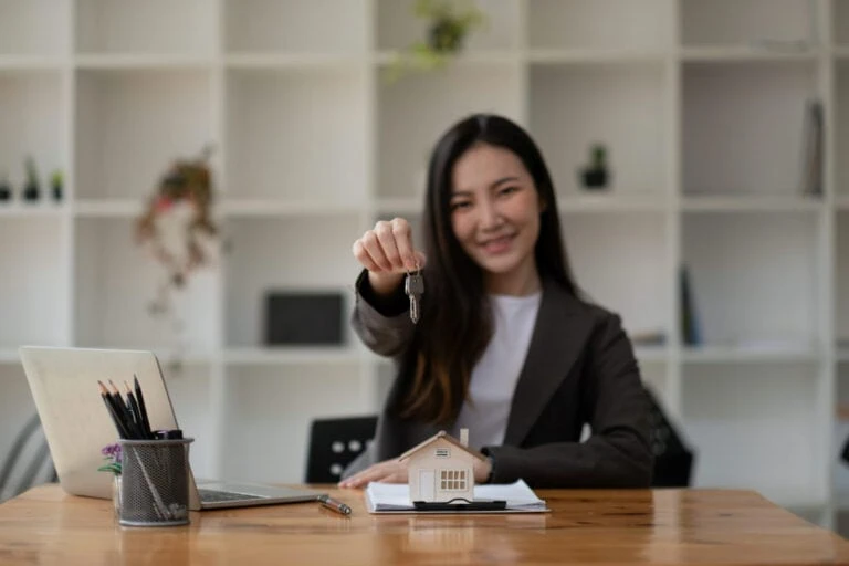 A happy new real estate agent with clients