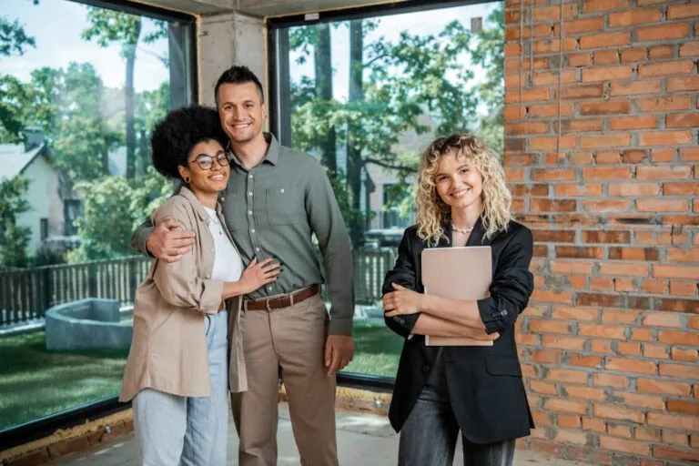 A happy new real estate agent with clients
